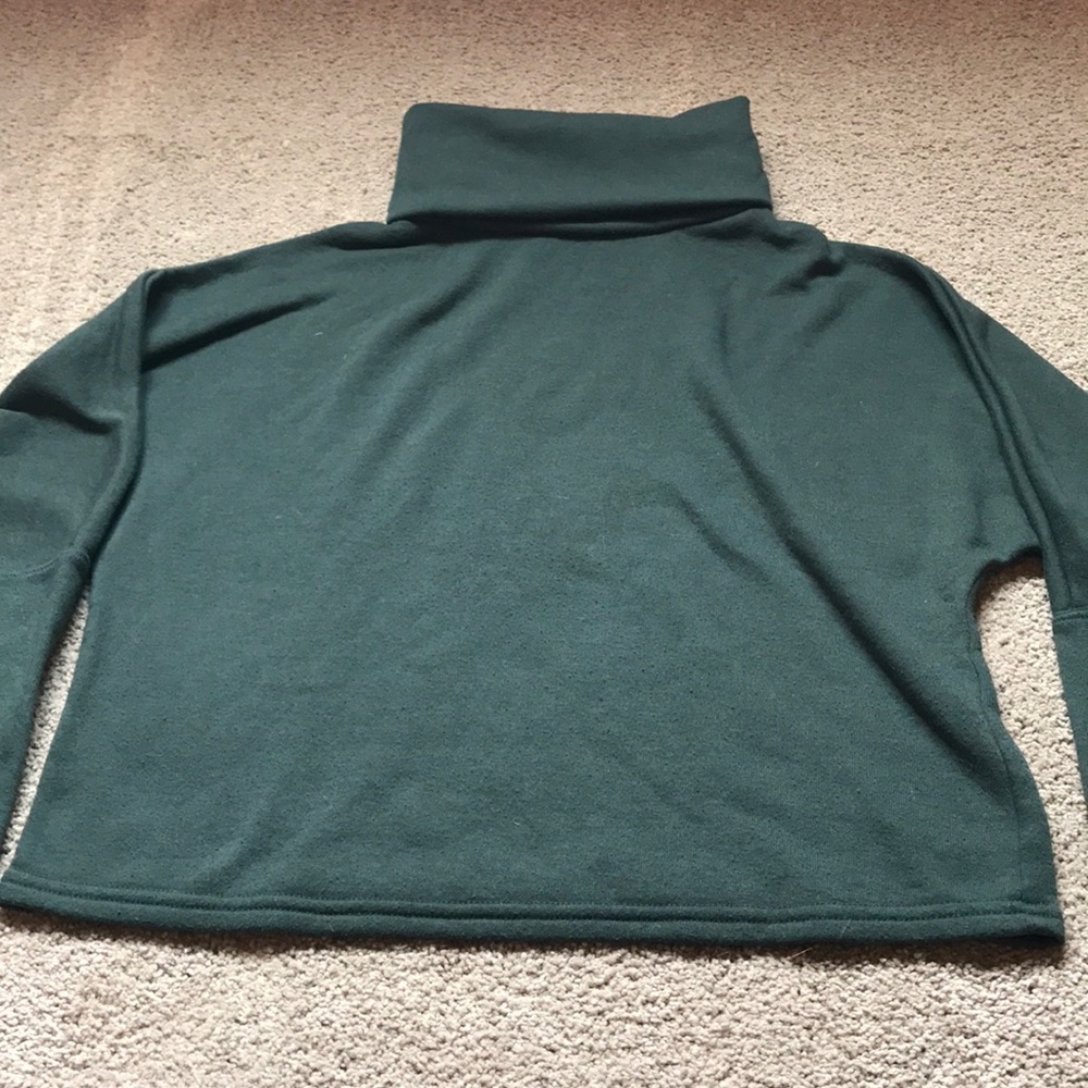 Oversized green turtleneck sweater
